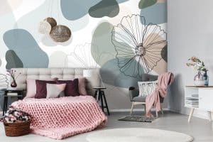 Le papier peint panoramique « Nature flise » est une envolée de bulles disparates aux couleurs pastel, qui jouent à cache-cache avec des effets de transparence : bleu doux, vert amande, beige rosé.