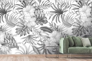 Le papier peint panoramique « Tropical ibisc » affiche sur un fond blanc une végétation exotique dans un désordre joyeux. Les feuilles tantôt teintées